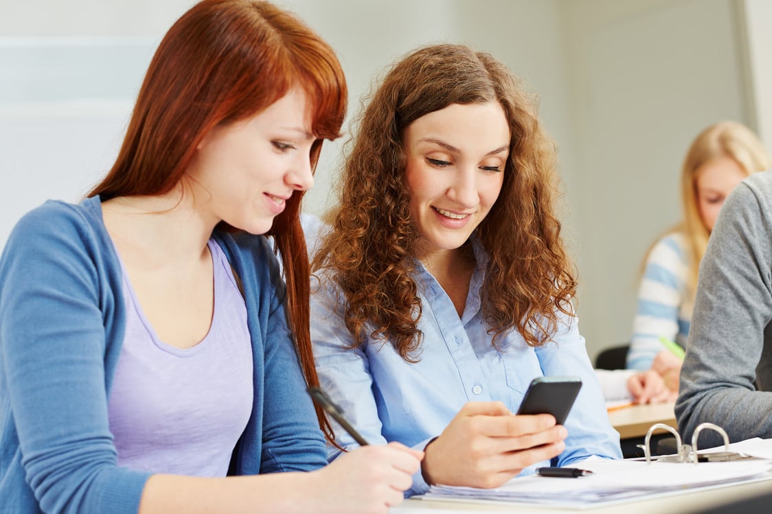 Women with Smartphone in University Class